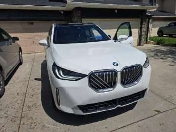 BMW X3 windshield replaced in a residential driveway